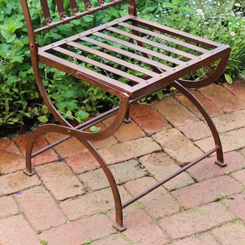 The seat of an outdoor metal chair