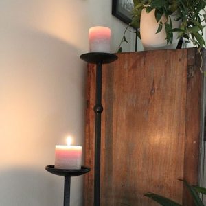 Candle stands with candles on them