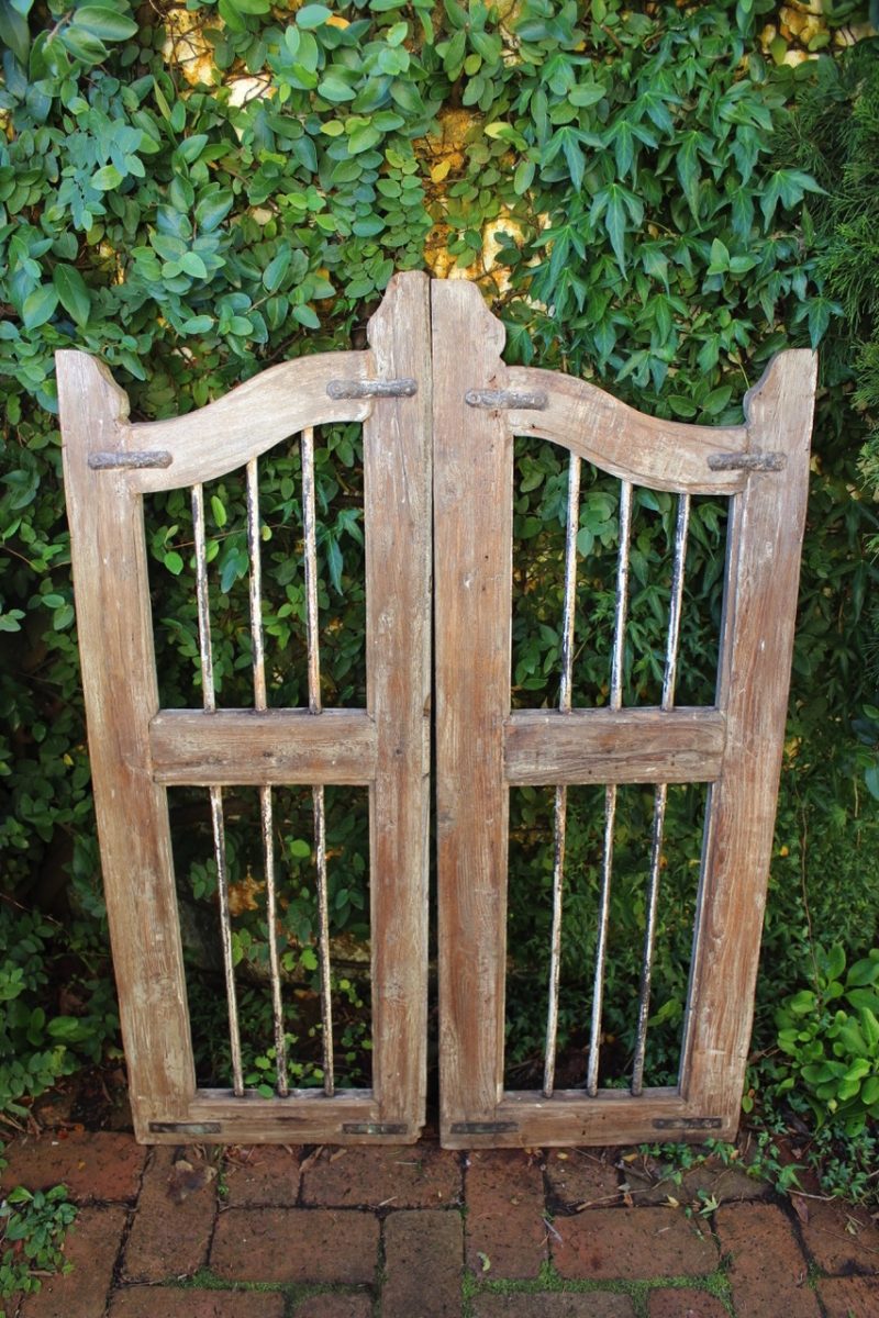 wooden gate with iron bars