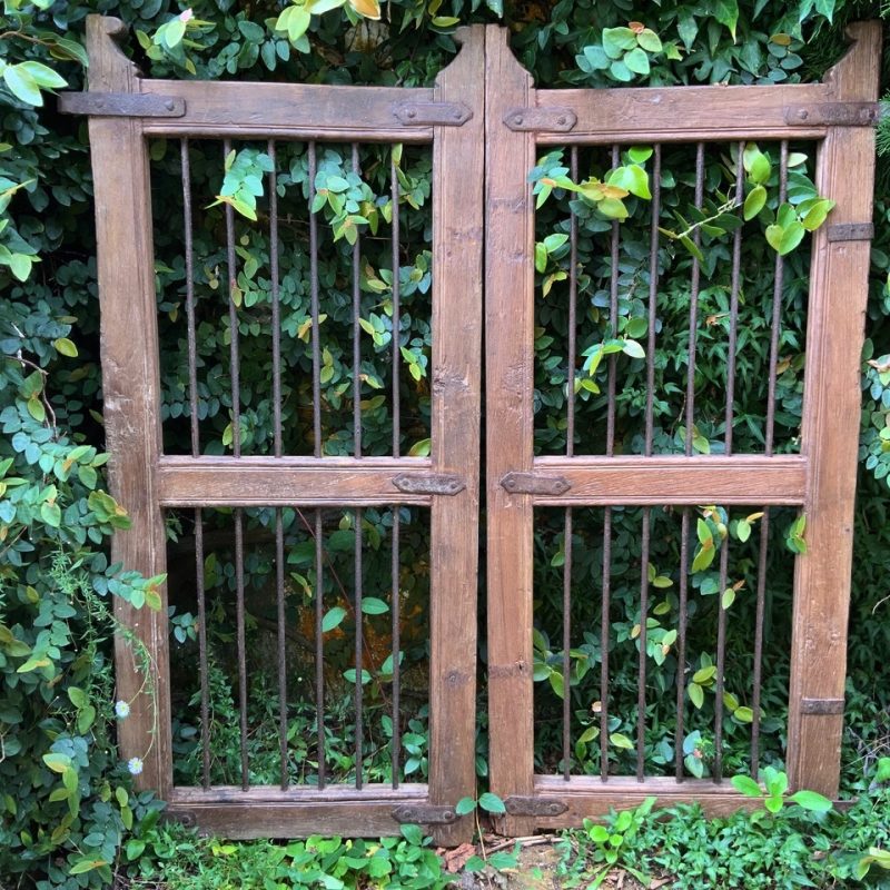 Timber gate with iron bars