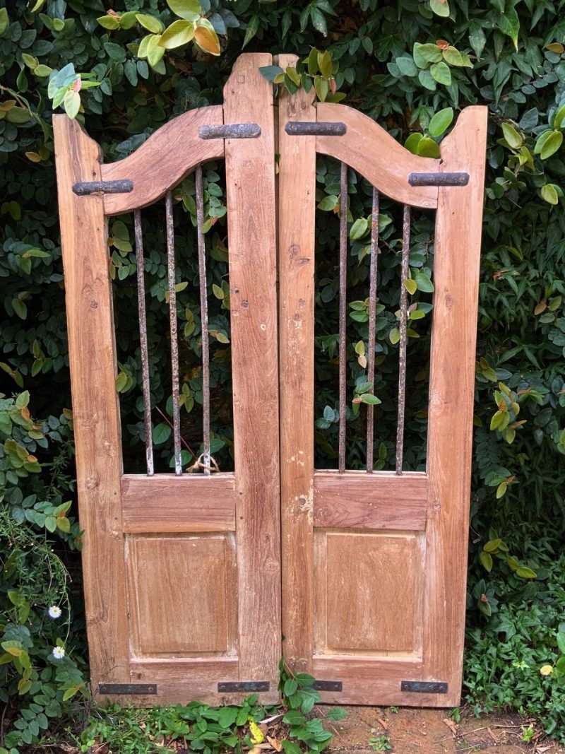 Timber gate with iron bars