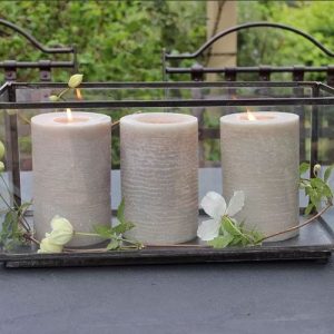 3 candles in a glass candle box