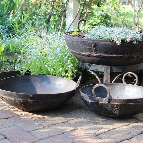 Black planters with trailing plants