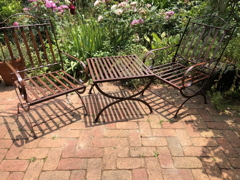 wrought iron chairs and side table