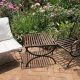 wrought iron chairs and table in a garden