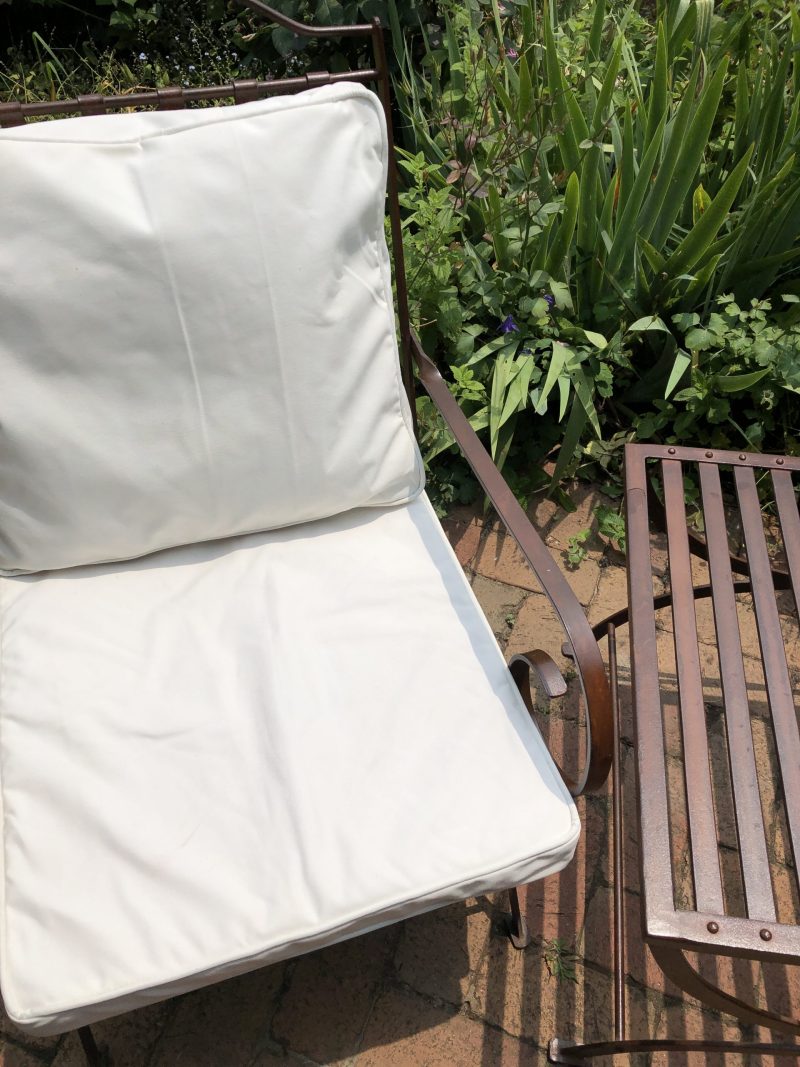 chair with cushions in a garden