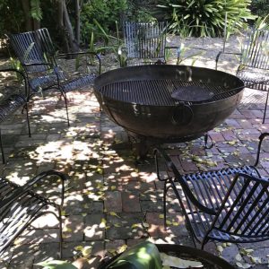 Garden chairs around a fire pit