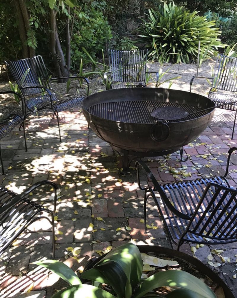 Garden chairs around a fire pit