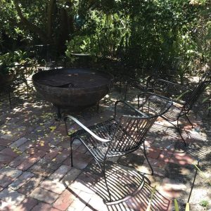 Garden chairs around a fire pit