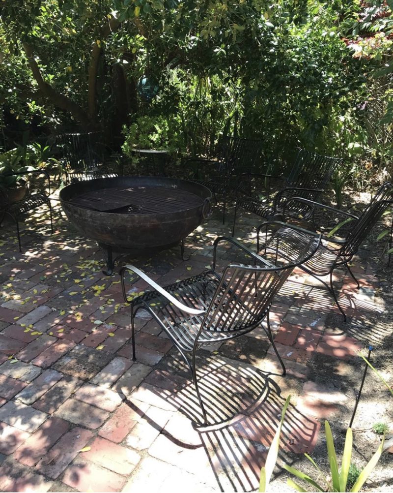 Garden chairs around a fire pit