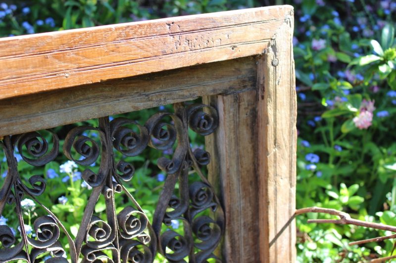 wrought iron scroll in timber frame