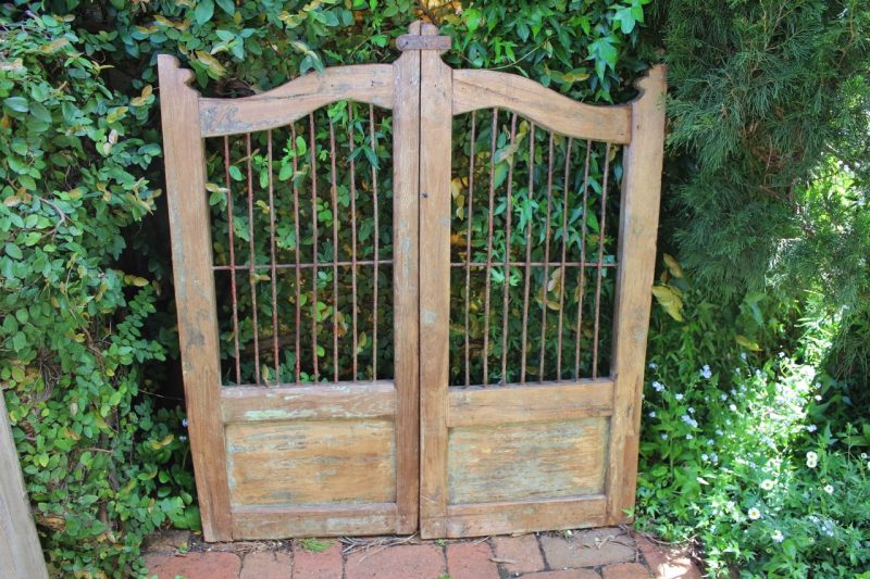wooden gate with iron bars