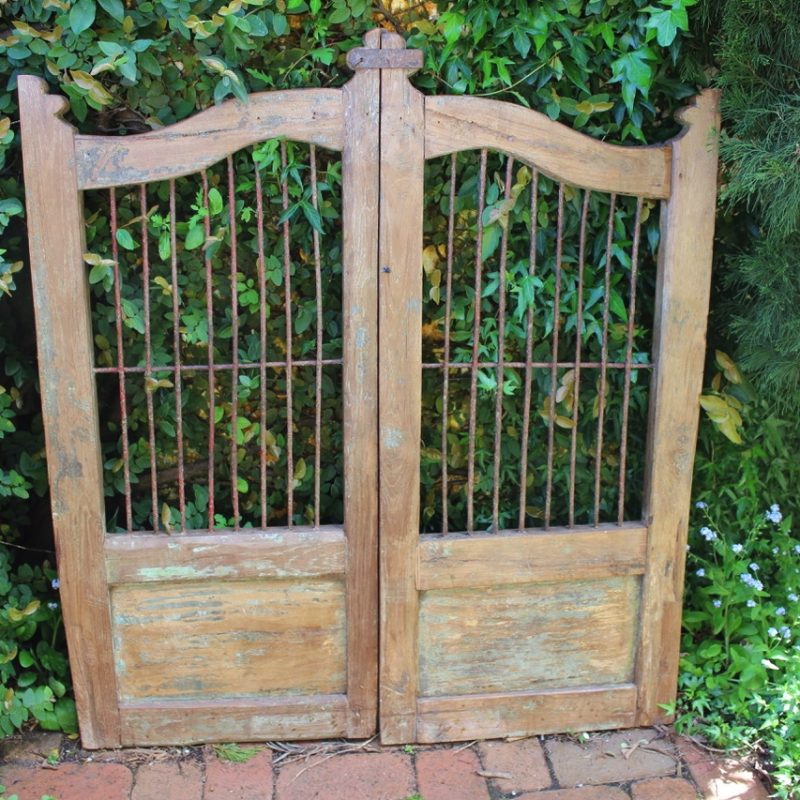 wooden gate with iron bars