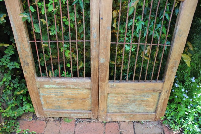 Timber gate with iron bars