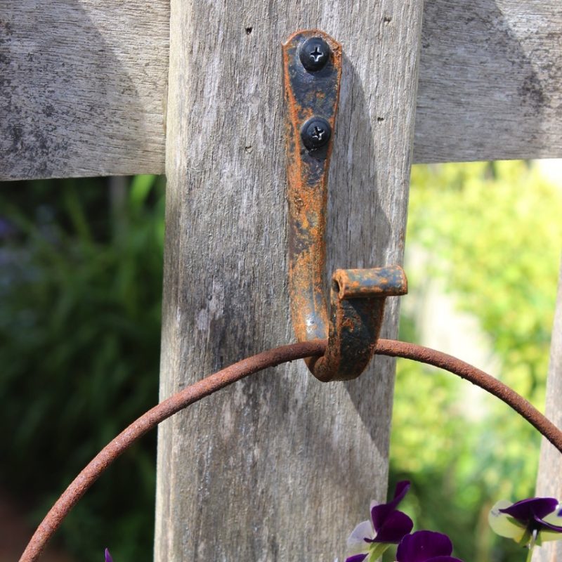 iron hook on a picket gate