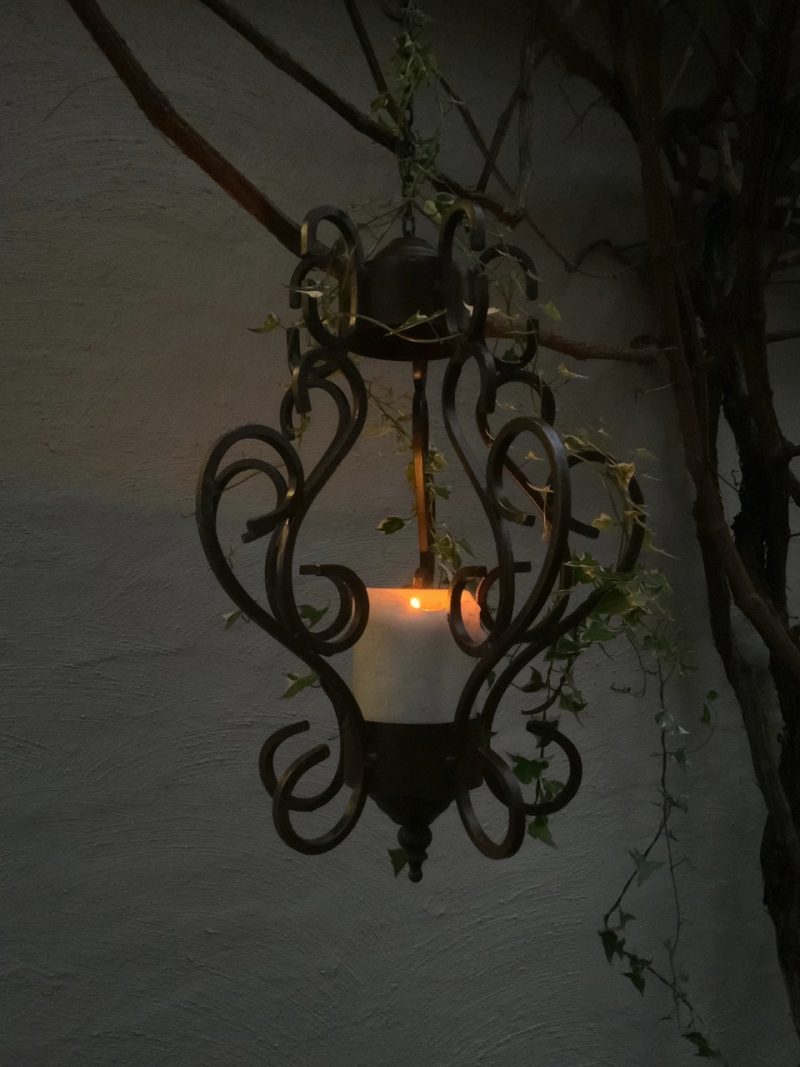 Iron chandelier with candle
